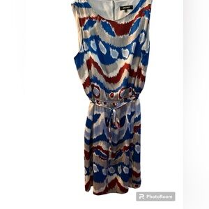 Super cute sleeveless dress with elastic waist and belting with matching fabric.